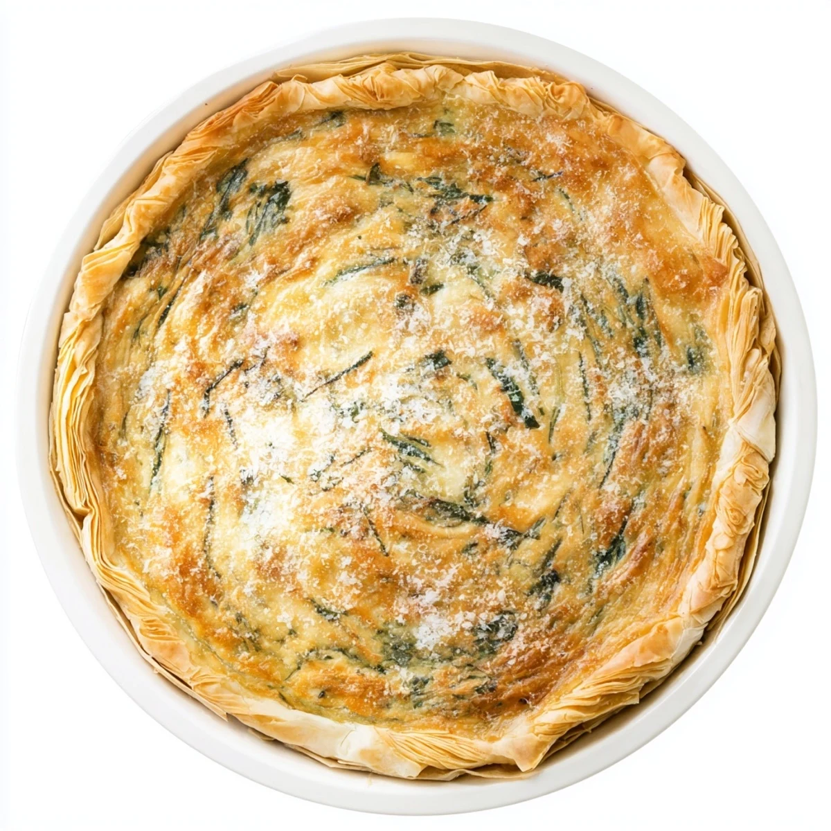 Savory silverbeet and ricotta egg pie sliced to reveal creamy cheesy spinach filling