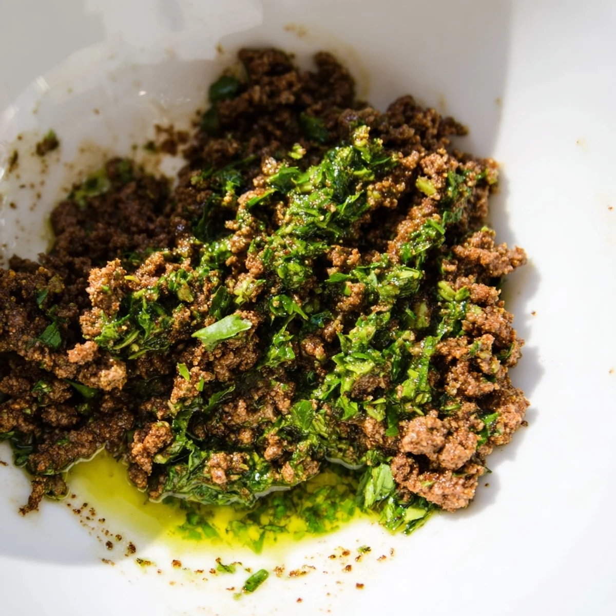 Chimichurri ground beef bowls with fresh avocado slices and vibrant green herb sauce