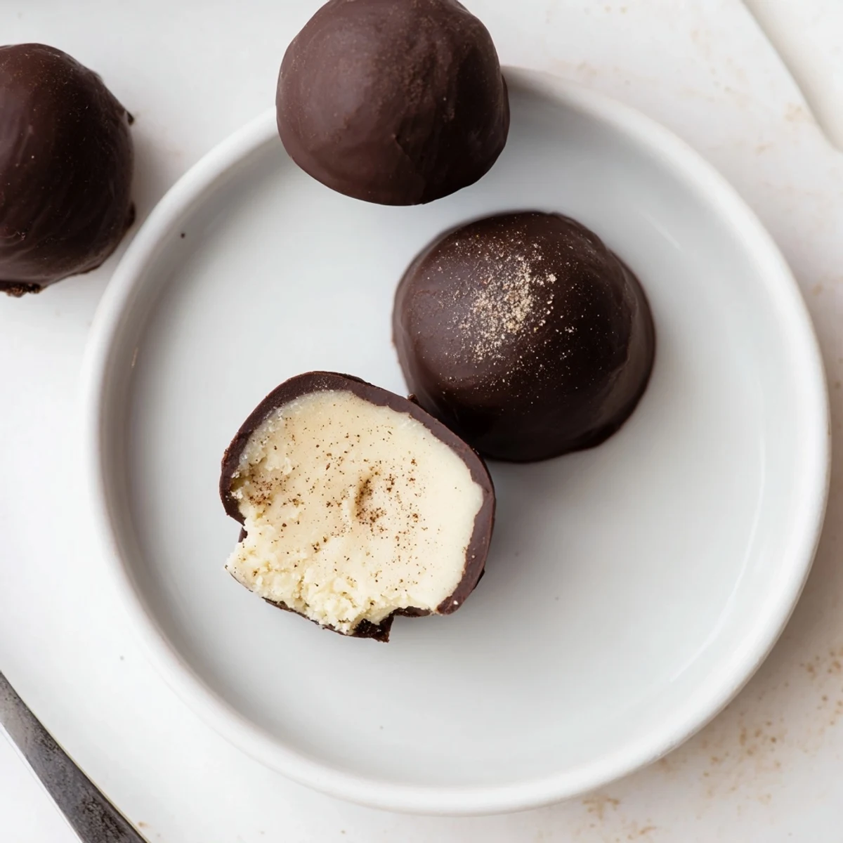 Hand-rolled Dark Chocolate Eggnog Truffles chilled for gifting, rich spice aroma