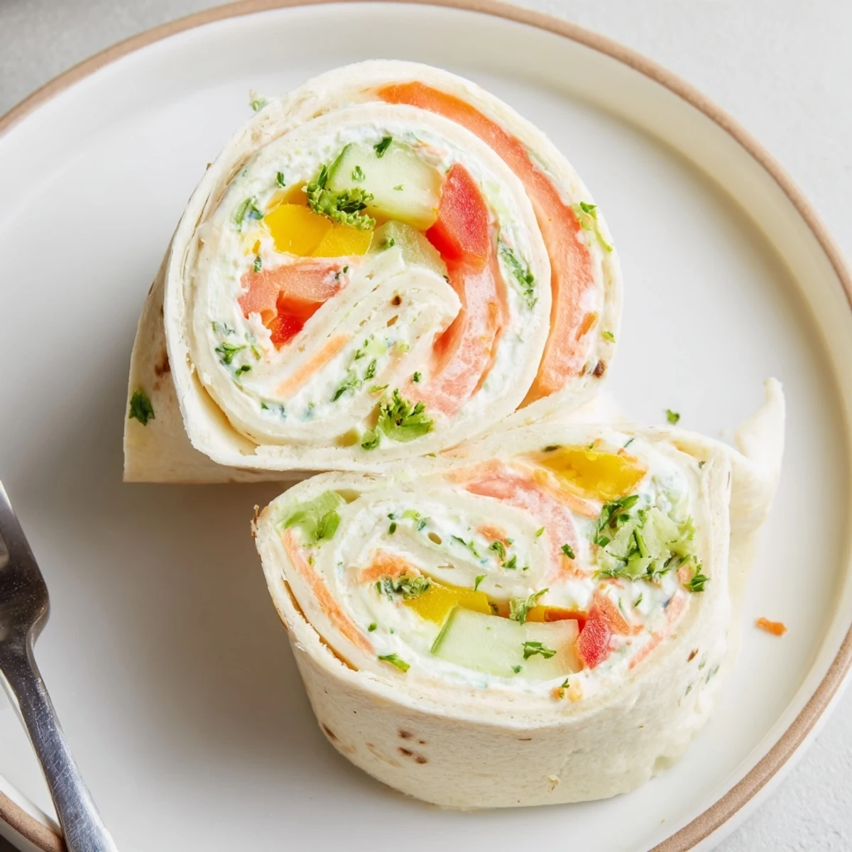 Platter of Vegetable Tortilla Roll Ups with creamy spread and crisp veggies