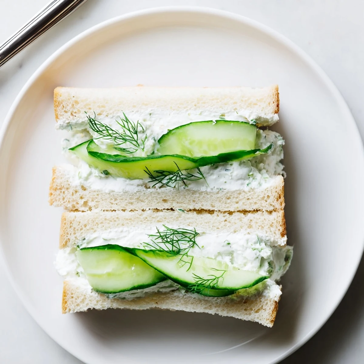 Light Classic Cucumber Sandwiches chilled with lemon-zest cream cheese, perfect picnic bites