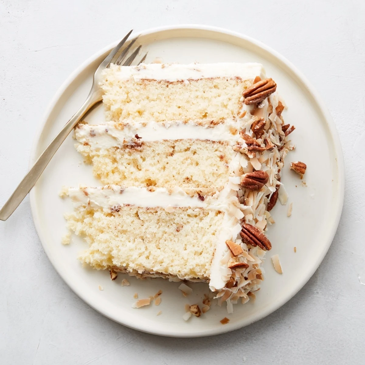 Homemade Quick Italian Cream Cake layered with coconut pecans and silky cream cheese frosting