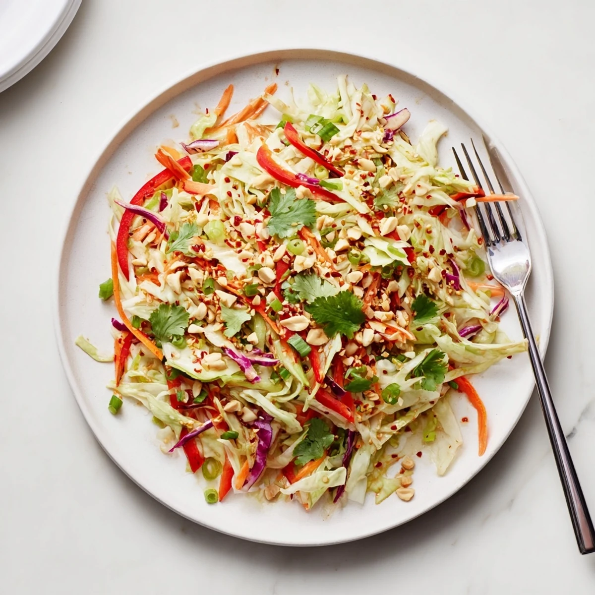 Bright Asian Cabbage Salad with toasted sesame, peanuts, and vivid shredded carrots