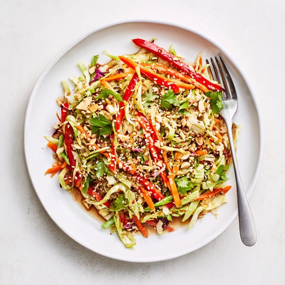 Asian Cabbage Salad tossed with sesame dressing, crunchy vegetables, cilantro aroma