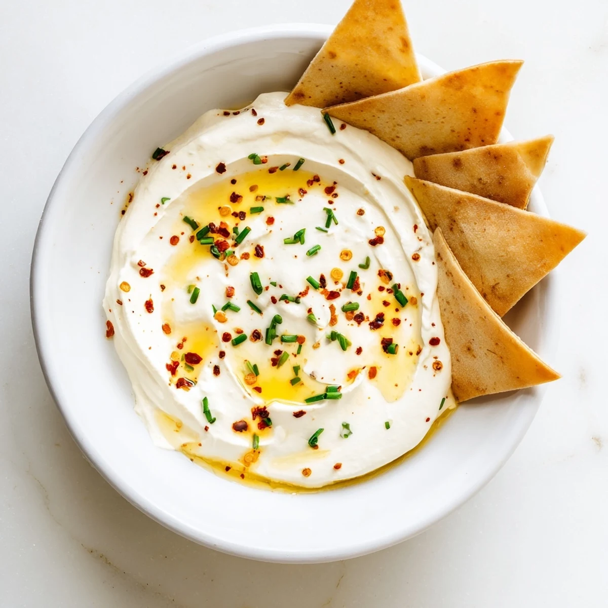 Smooth Mediterranean whipped feta dip served with crusty bread and hot honey
