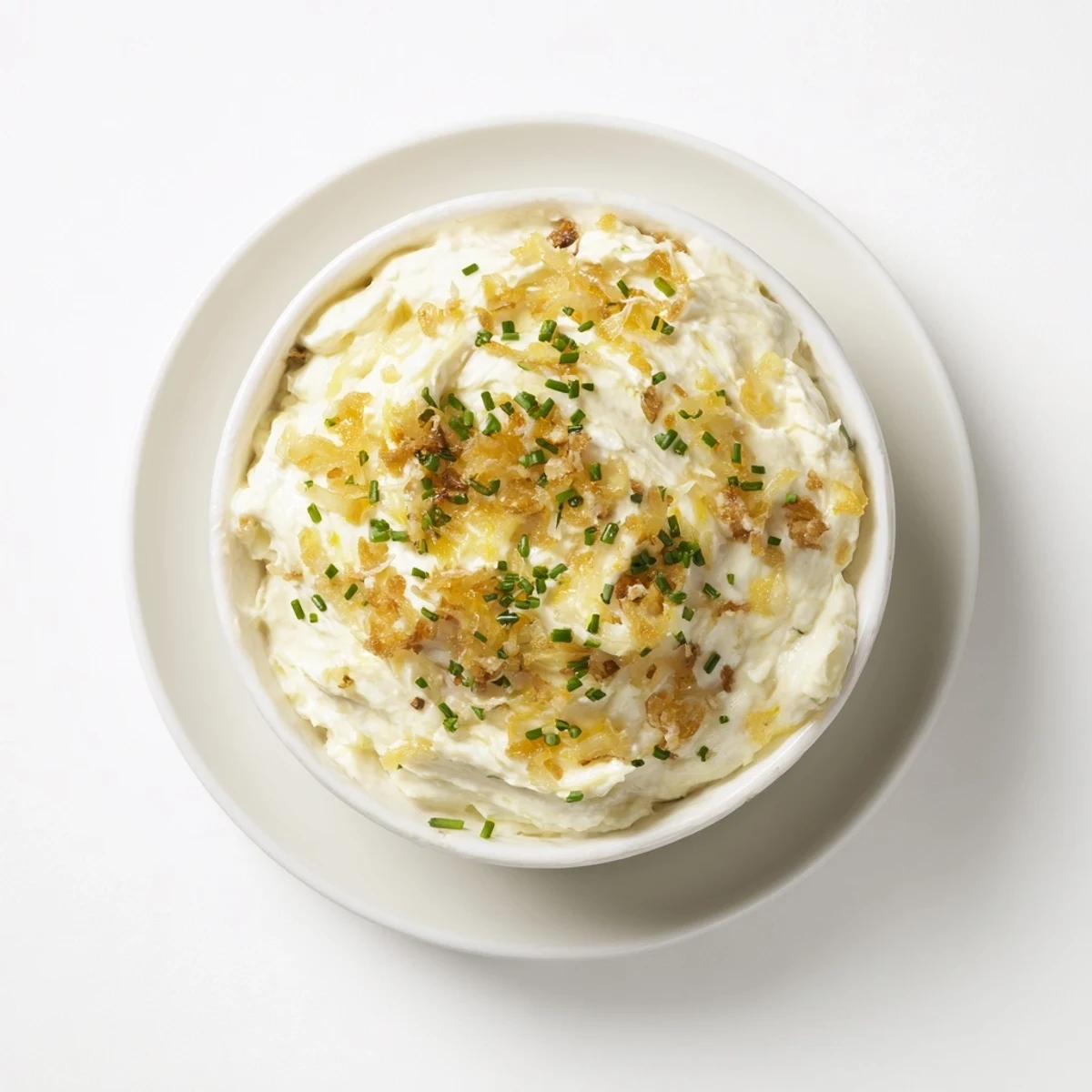 Bowl of homemade French onion dip served with crispy potato chips