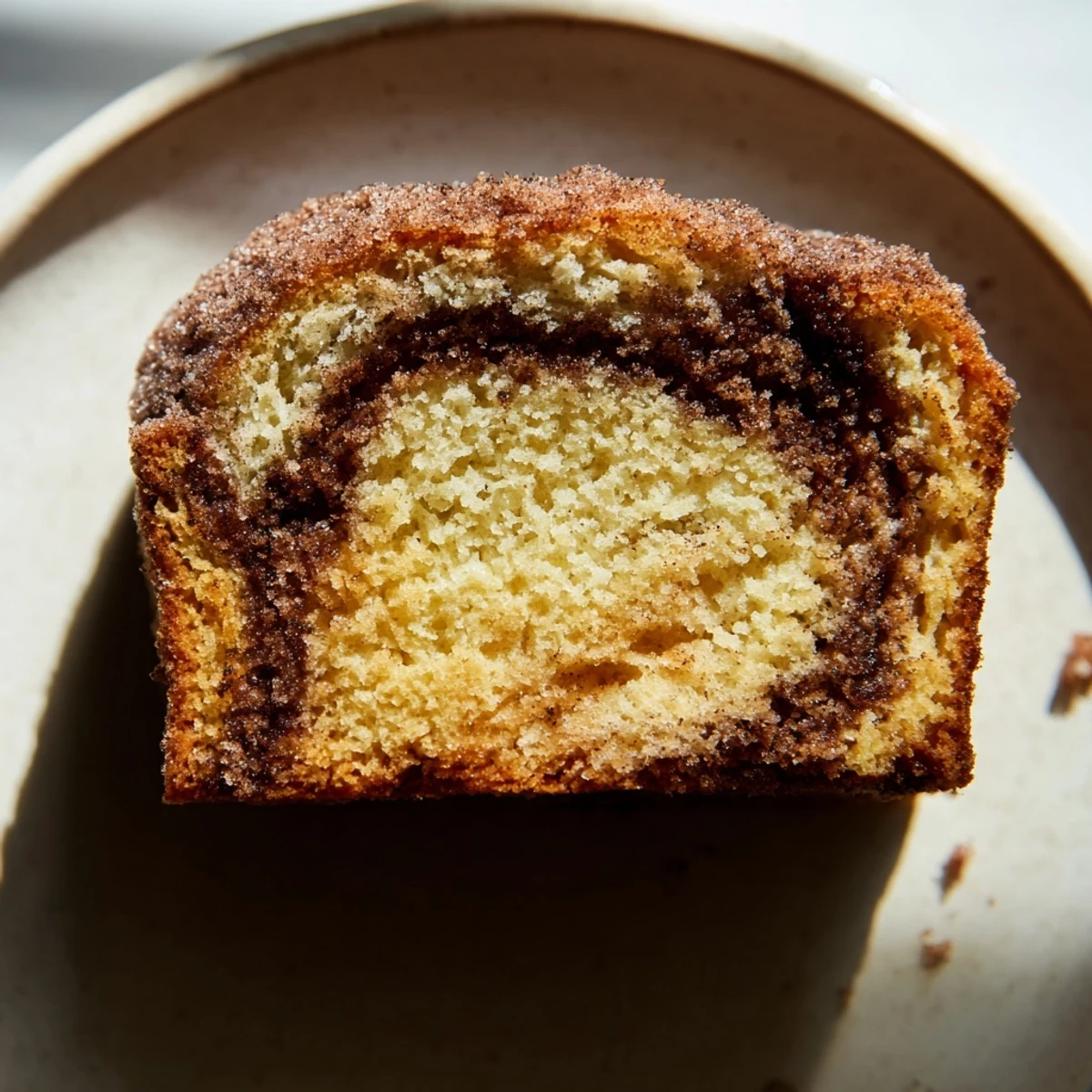 Golden cinnamon donut loaf brushed with melted butter and coated in spiced sugar topping